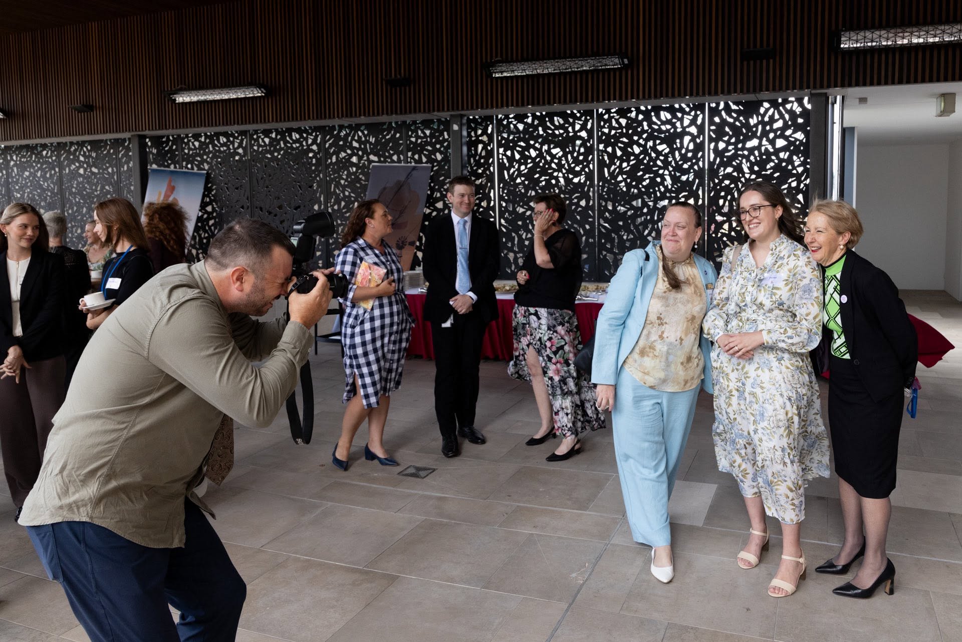 Emi Hall networking with colleagues