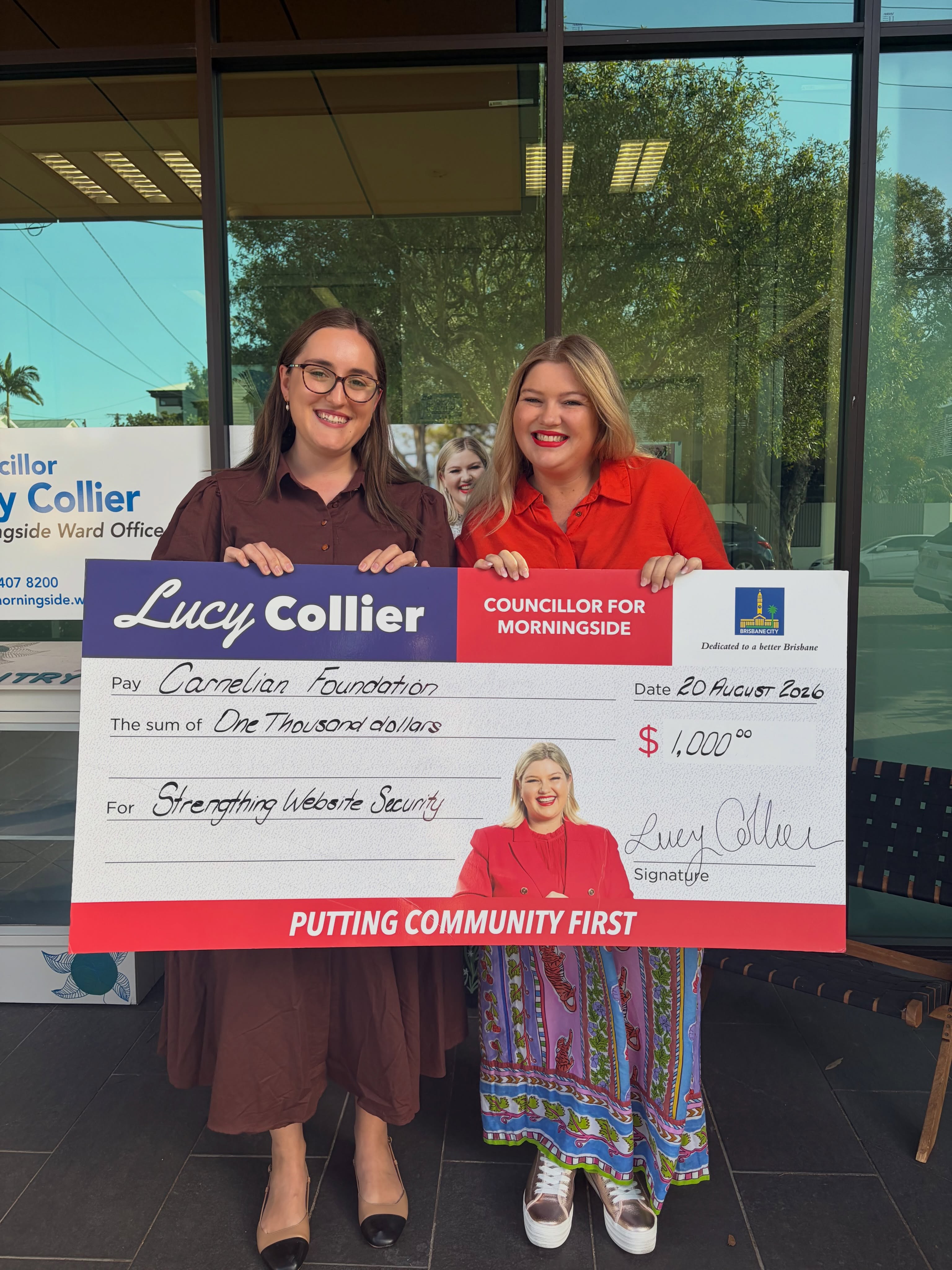 Emi Hall receiving a community grant for the Carnelian Foundation